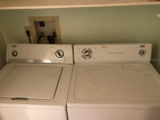 a view of a swimming pool with sitting area