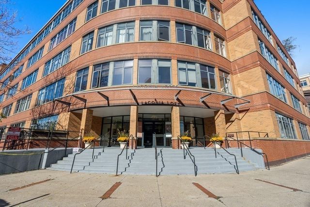 a view of a building with a sitting area