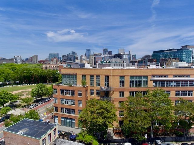 a view of a large building with a city view
