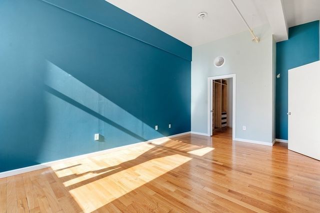 a view of a livingroom with wooden floor