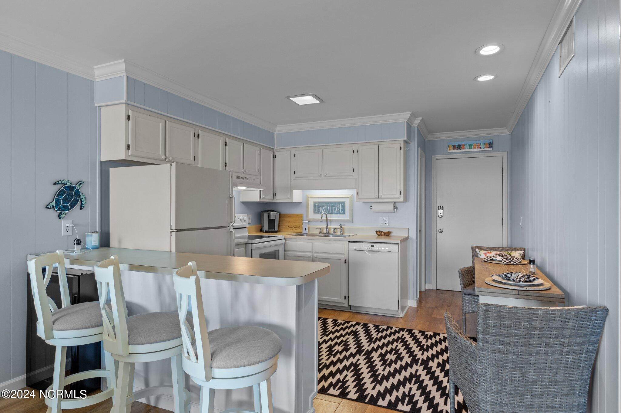 301 Commerce Way, Unit 349 Atlantic Beach, NC 28512 - Photo 13 of 38 Bar Seating and Wine Fridge