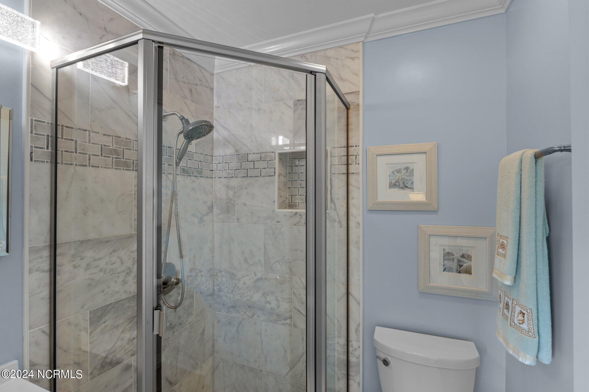 301 Commerce Way, Unit 349 Atlantic Beach, NC 28512 - Photo 19 of 38 En-Suite Primary Bathroom