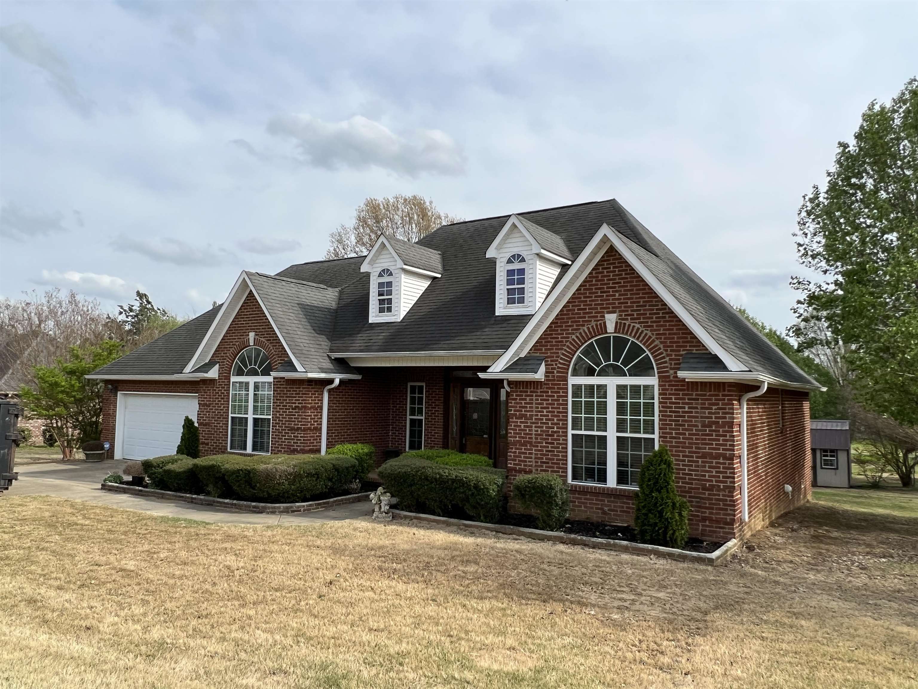 a front view of a house with a yard