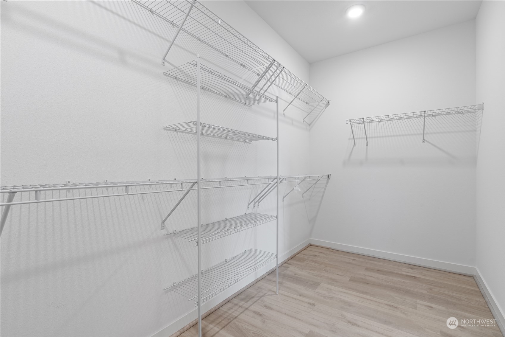 21722 24th Avenue Southeast, Unit A Bothell, WA 98021 - Photo 22 of 38 a view of a room with racks on the wall