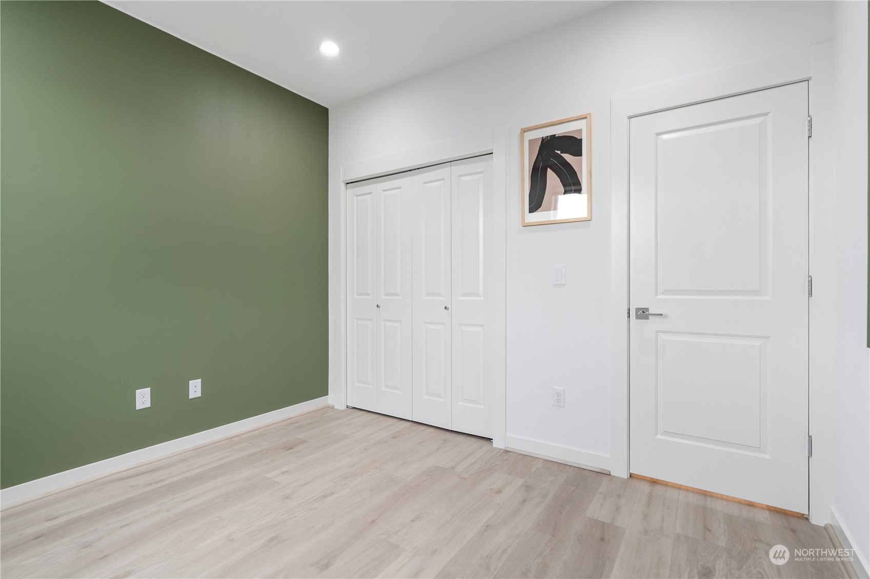 21722 24th Avenue Southeast, Unit A Bothell, WA 98021 - Photo 27 of 38 an empty room with windows and closet