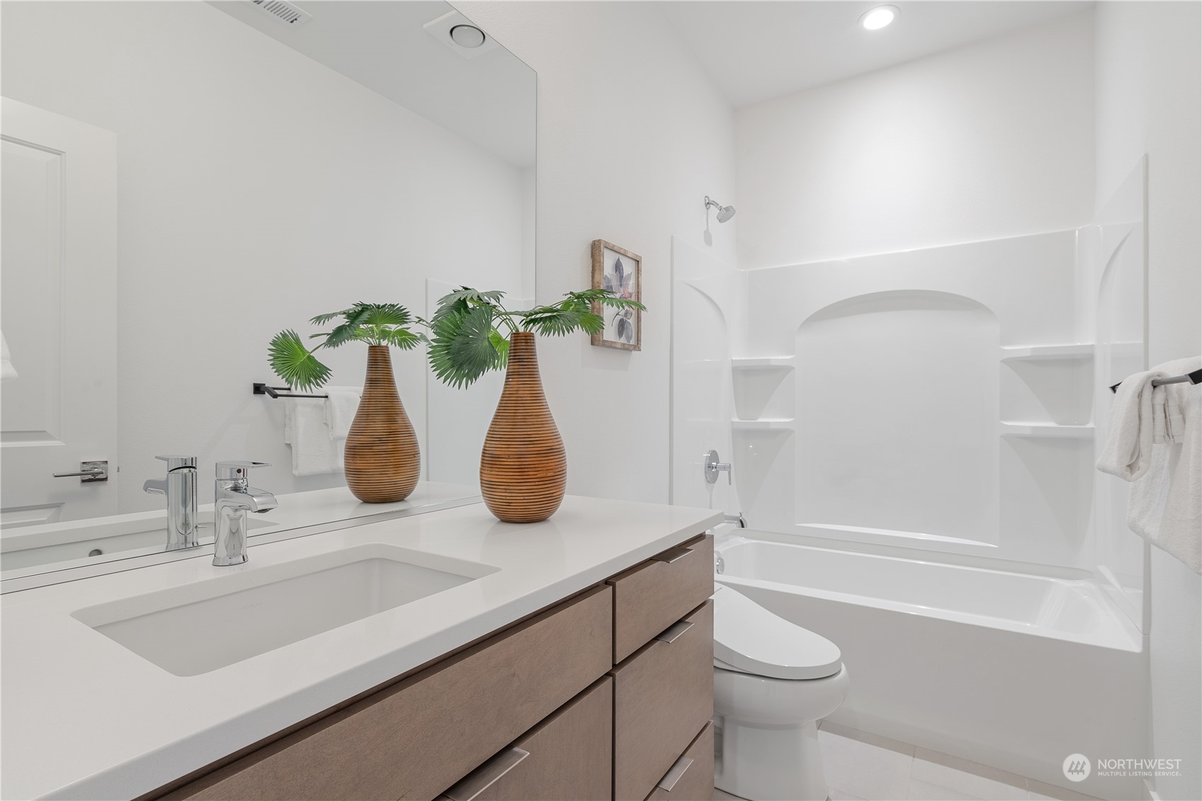 21722 24th Avenue Southeast, Unit A Bothell, WA 98021 - Photo 30 of 38 a bathroom with a sink a toilet and bathtub