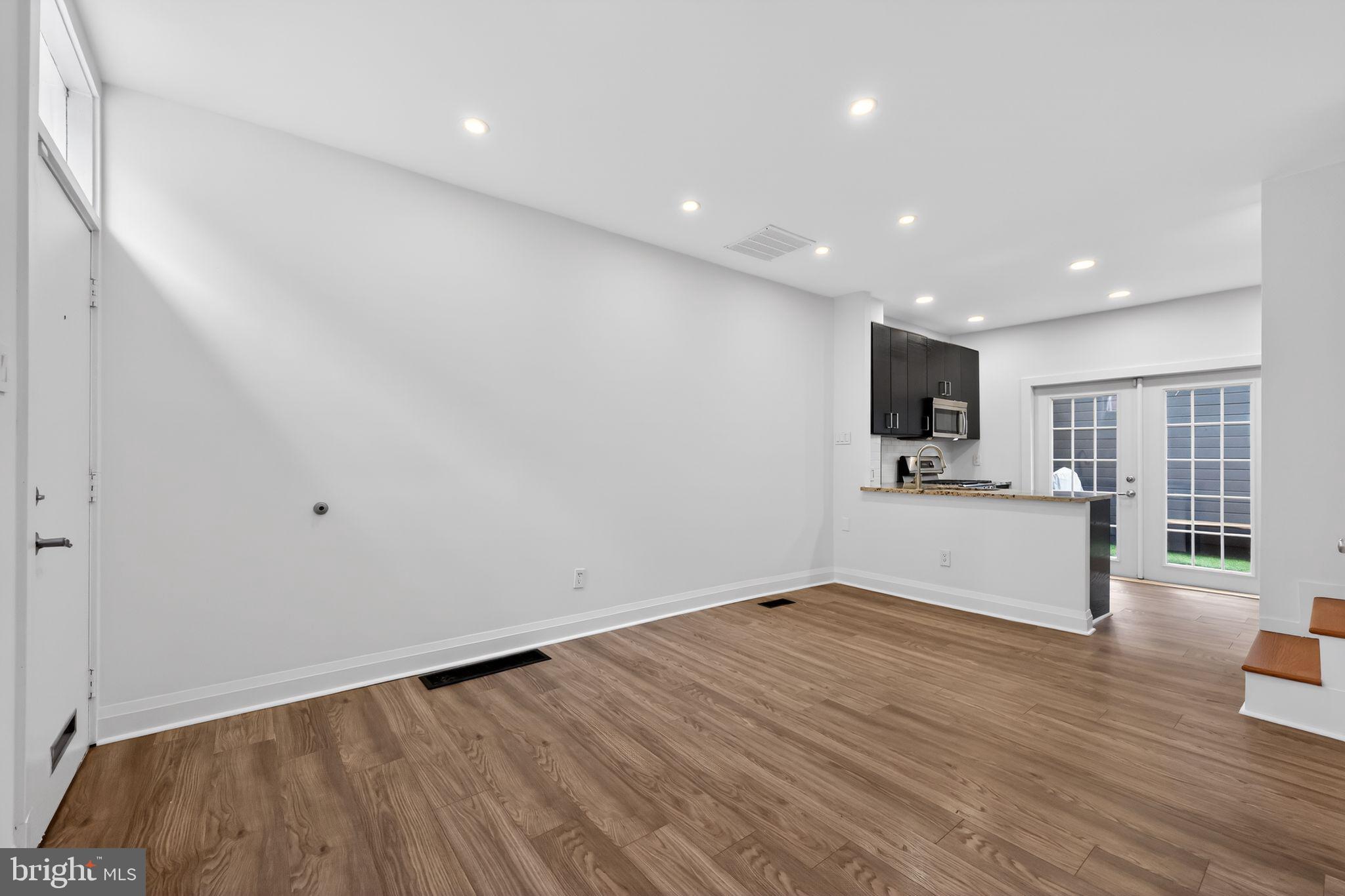 608 Kater Street Philadelphia, PA 19147 - Photo 7 of 30 a view of empty room with wooden floor and a window