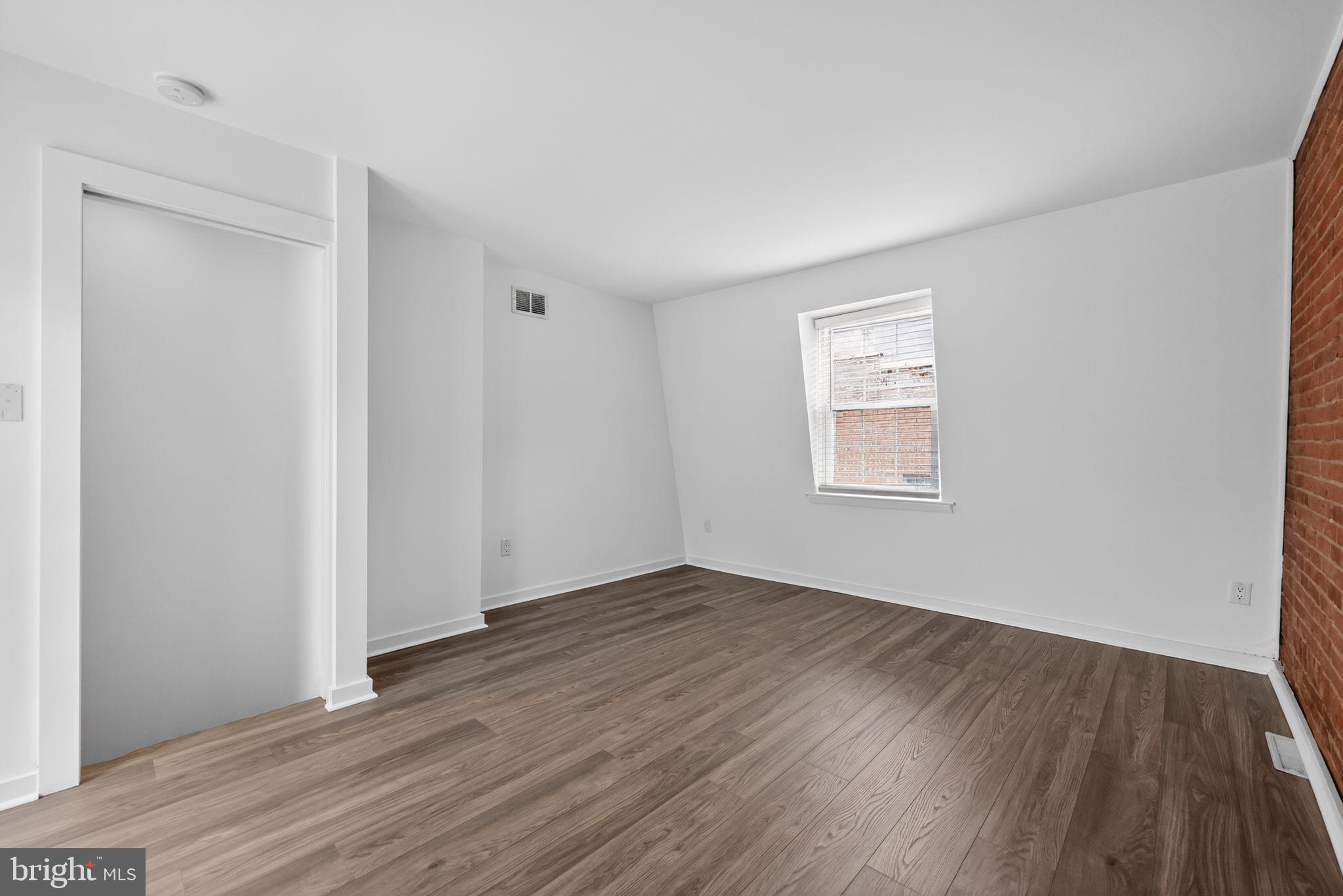 608 Kater Street Philadelphia, PA 19147 - Photo 9 of 30 an empty room with wooden floor and windows