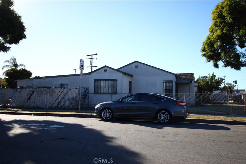 4522 East Rosecrans Avenue Compton, CA 90221 - Photo 13 of 75 a view of a car parked in front of a house
