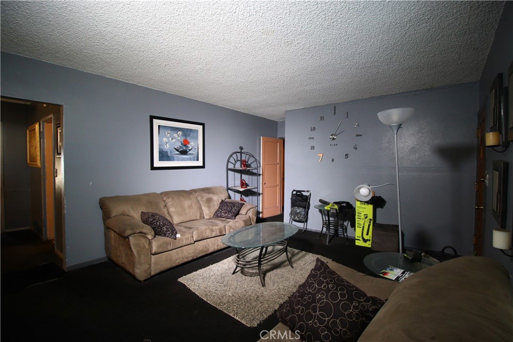 4522 East Rosecrans Avenue Compton, CA 90221 - Photo 23 of 75 a living room with furniture and wooden floor