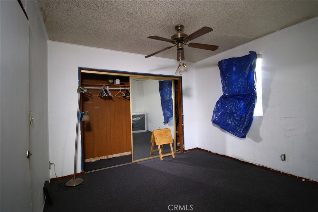 4522 East Rosecrans Avenue Compton, CA 90221 - Photo 32 of 75 a view of a hallway with wooden floor and closet