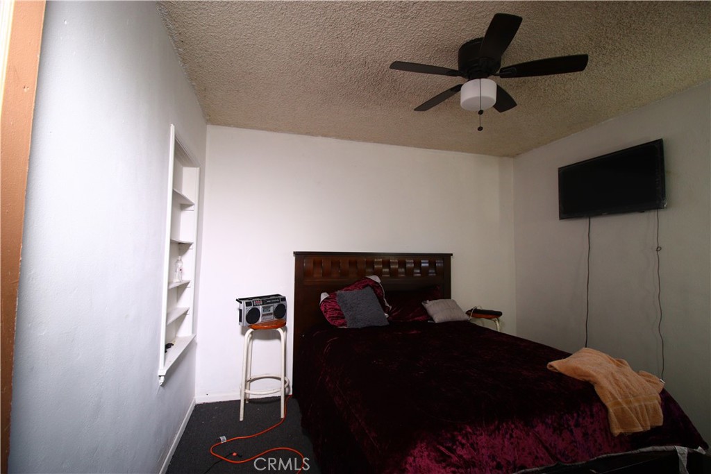 4522 East Rosecrans Avenue Compton, CA 90221 - Photo 46 of 75 a bedroom with a bed and a tv