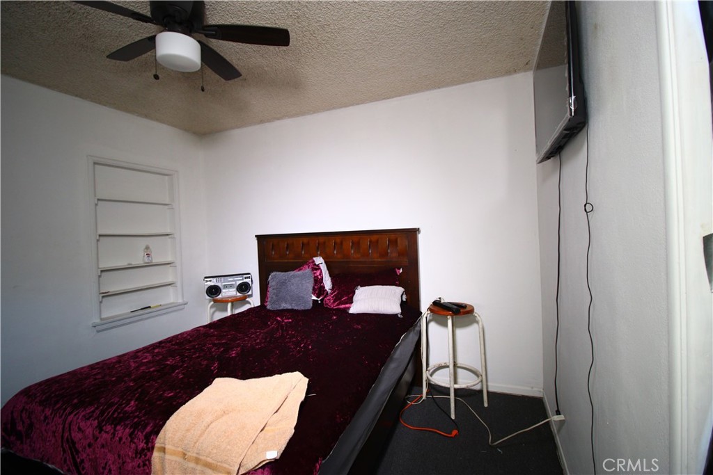 4522 East Rosecrans Avenue Compton, CA 90221 - Photo 49 of 75 a living room with furniture a rug and white walls