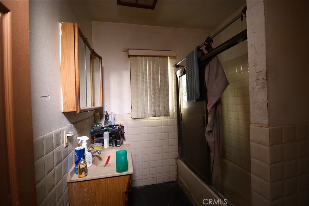 4522 East Rosecrans Avenue Compton, CA 90221 - Photo 51 of 75 a view of walk in closet with clothes and shoes