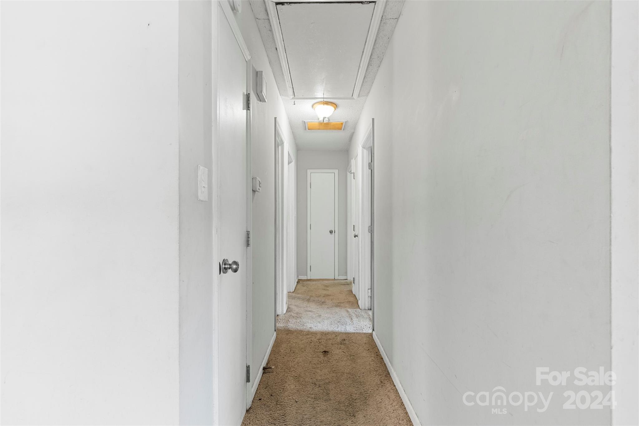 6803 North Ridge Court Charlotte, NC 28215 - Photo 11 of 30 a view of a hallway with wooden floor