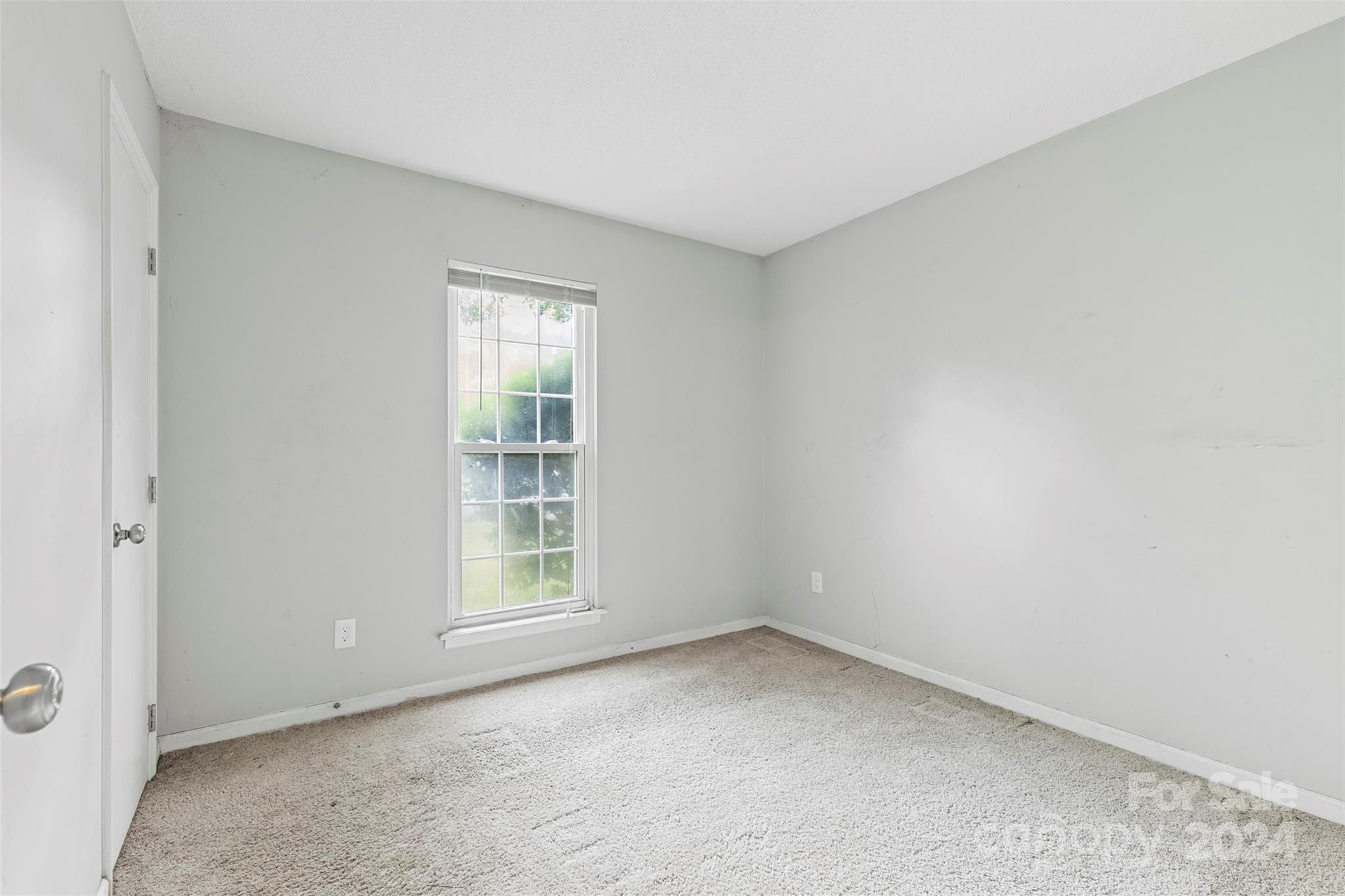 6803 North Ridge Court Charlotte, NC 28215 - Photo 12 of 30 an empty room with a window