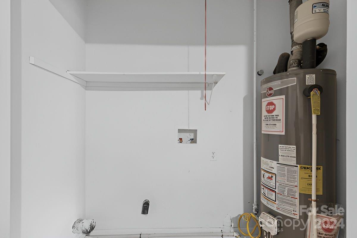 6803 North Ridge Court Charlotte, NC 28215 - Photo 21 of 30 a view of storage and utility room with racks on the wall