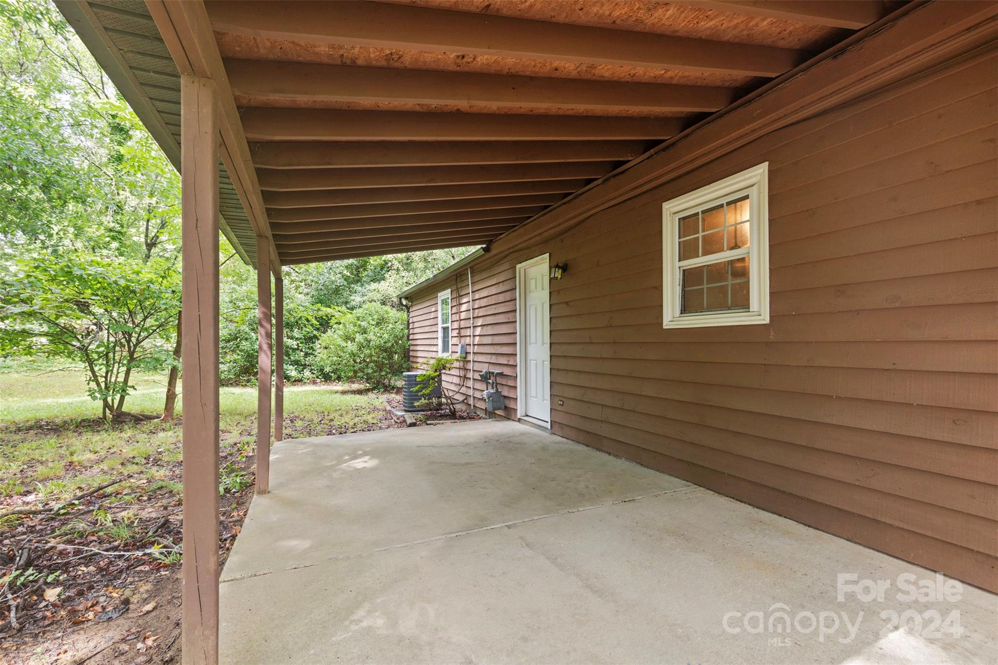6803 North Ridge Court Charlotte, NC 28215 - Photo 23 of 30 a view of a house with backyard and porch