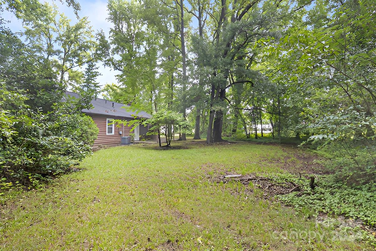 6803 North Ridge Court Charlotte, NC 28215 - Photo 27 of 30 a front view of a house with a yard