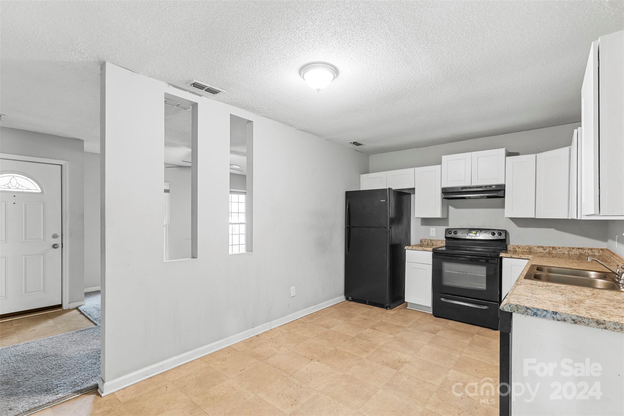 6803 North Ridge Court Charlotte, NC 28215 - Photo 5 of 30 a kitchen with stainless steel appliances granite countertop a stove a refrigerator and a sink