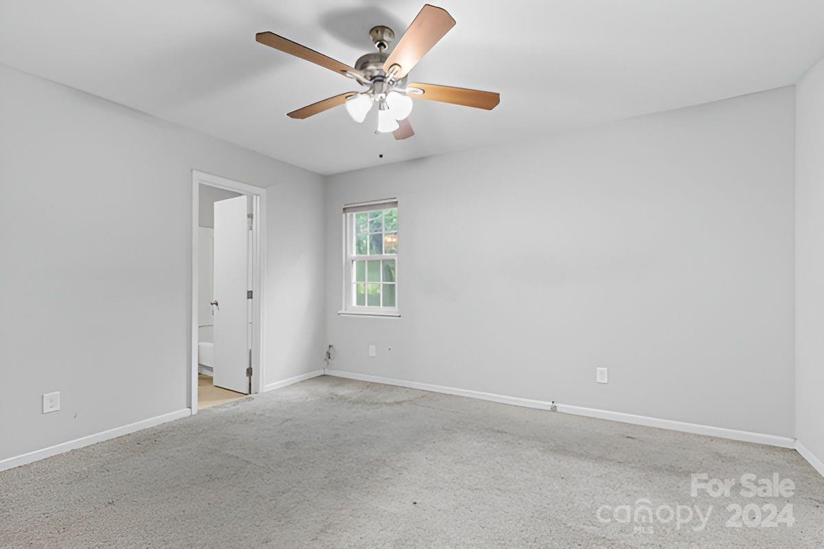 6803 North Ridge Court Charlotte, NC 28215 - Photo 6 of 30 an empty room with a window