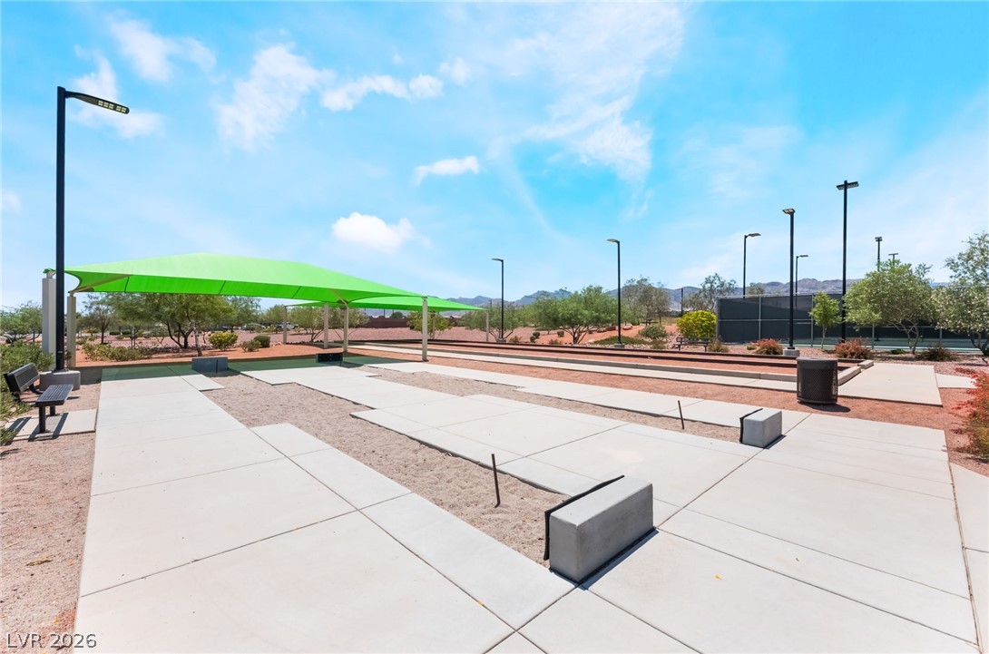6432 Spring Jog Street Las Vegas, NV 89166 - Photo 43 of 61 Bocce ball courts and shaded seating offer leisurely outdoor recreation in this desert landscape.