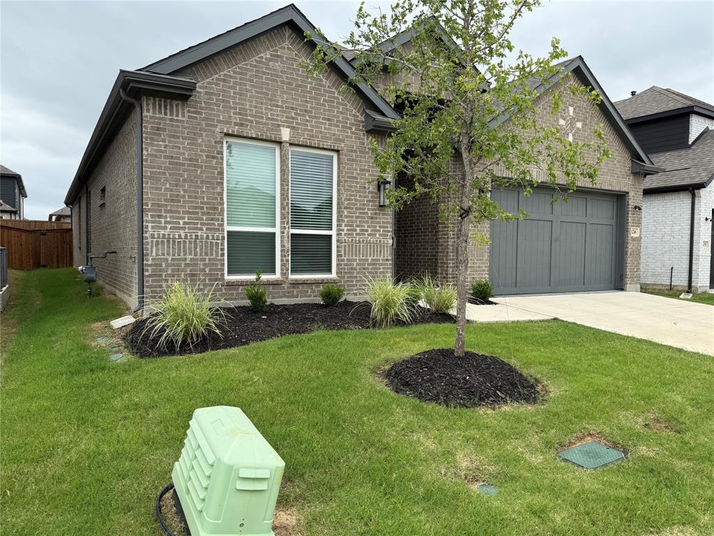 6246 Shasta Creek Road Celina, TX 75009 - Photo 3 of 24 a house view with a garden space