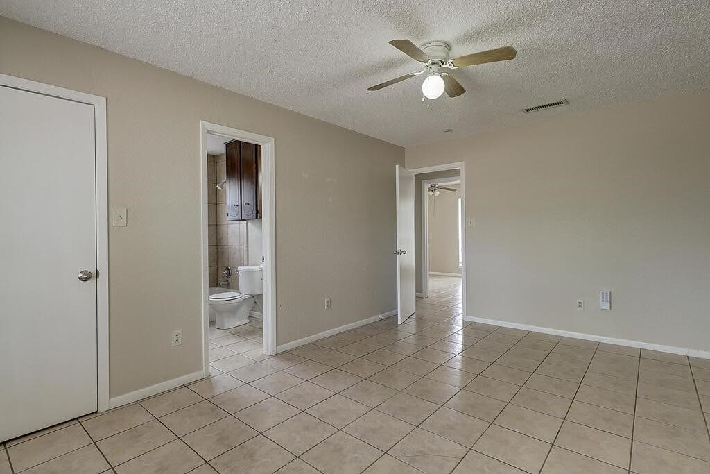 5225 Bonham Street Corpus Christi, TX 78415 - Photo 22 of 40 a view of an empty room and window a ceiling fan