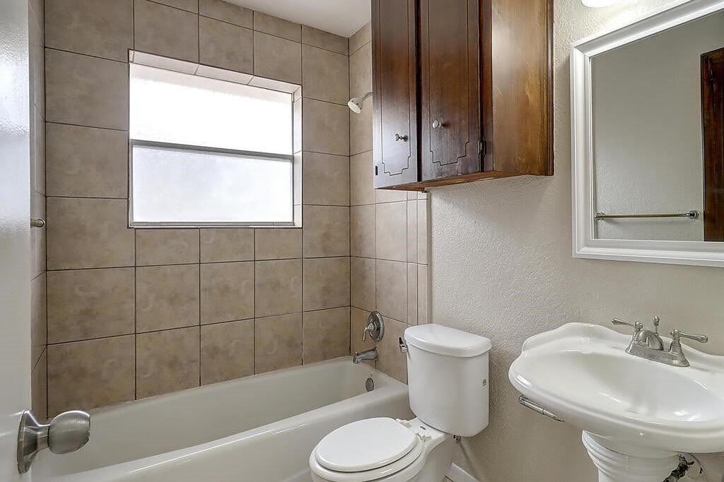 5225 Bonham Street Corpus Christi, TX 78415 - Photo 23 of 40 a bathroom with a sink toilet and shower
