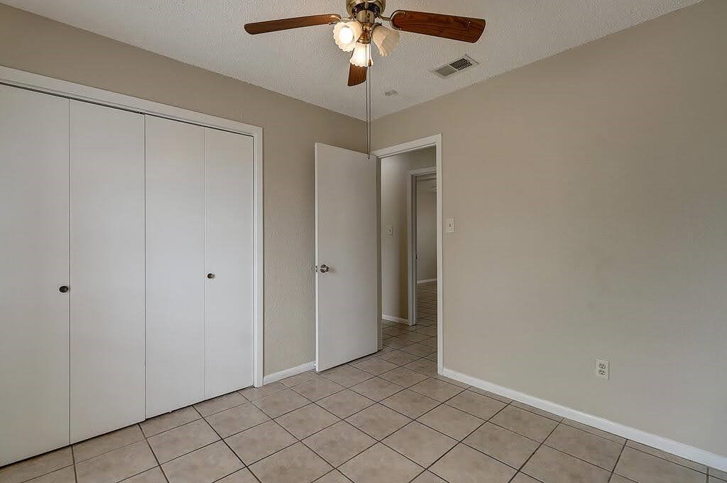 5225 Bonham Street Corpus Christi, TX 78415 - Photo 27 of 40 a view of an empty room and chandelier fan