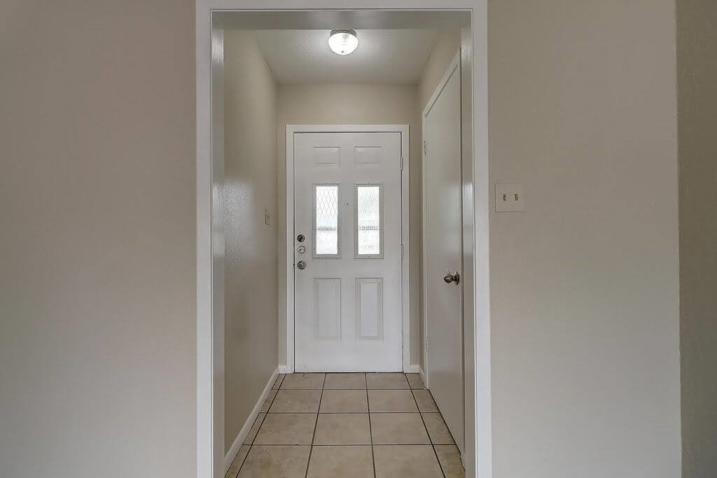 5225 Bonham Street Corpus Christi, TX 78415 - Photo 3 of 40 a view of a hallway with a wooden floor