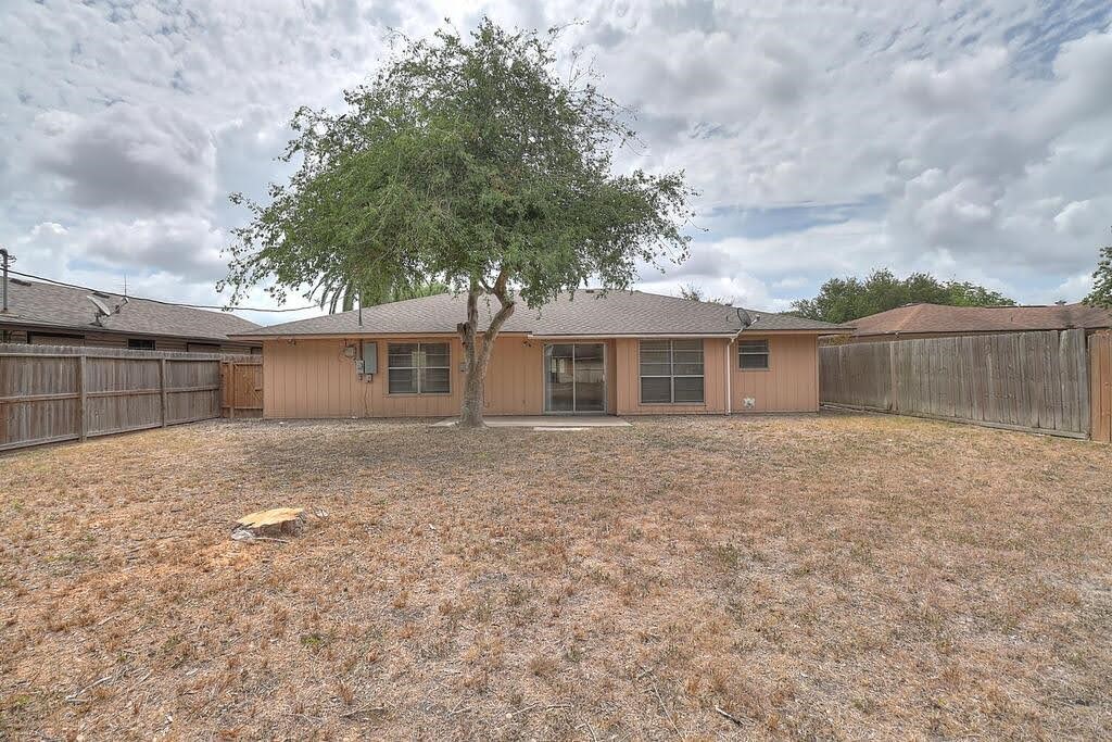 5225 Bonham Street Corpus Christi, TX 78415 - Photo 39 of 40 a backyard of a house with large trees and barbeque oven
