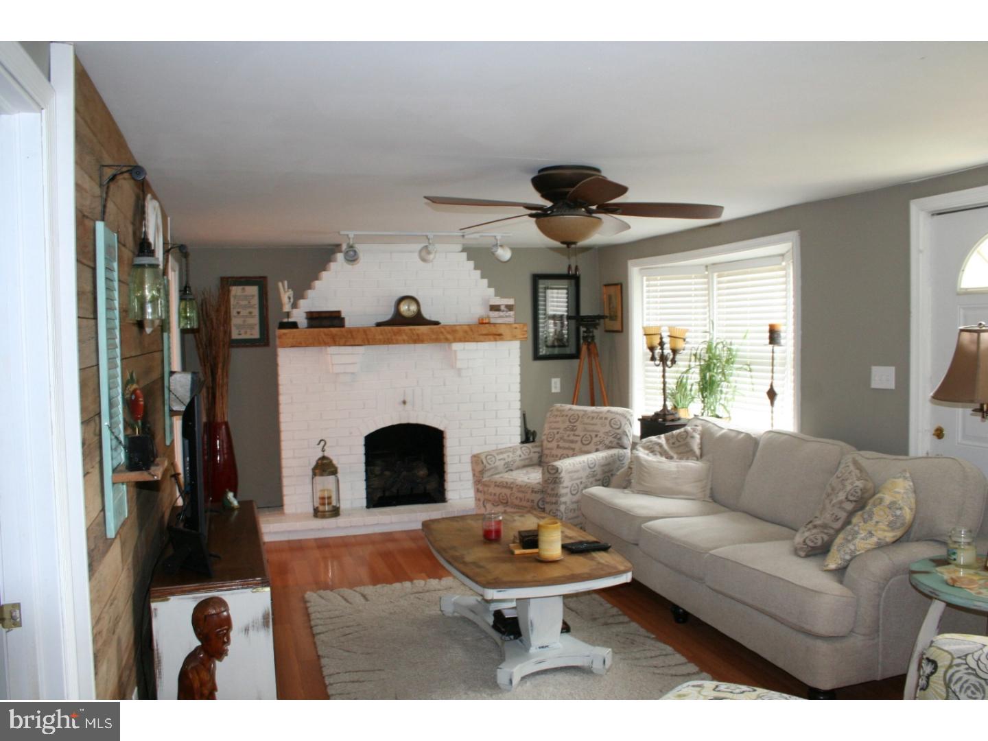 468 Alvine Road Elmer, NJ 08318 - Photo 13 of 25 a living room with furniture and a fireplace