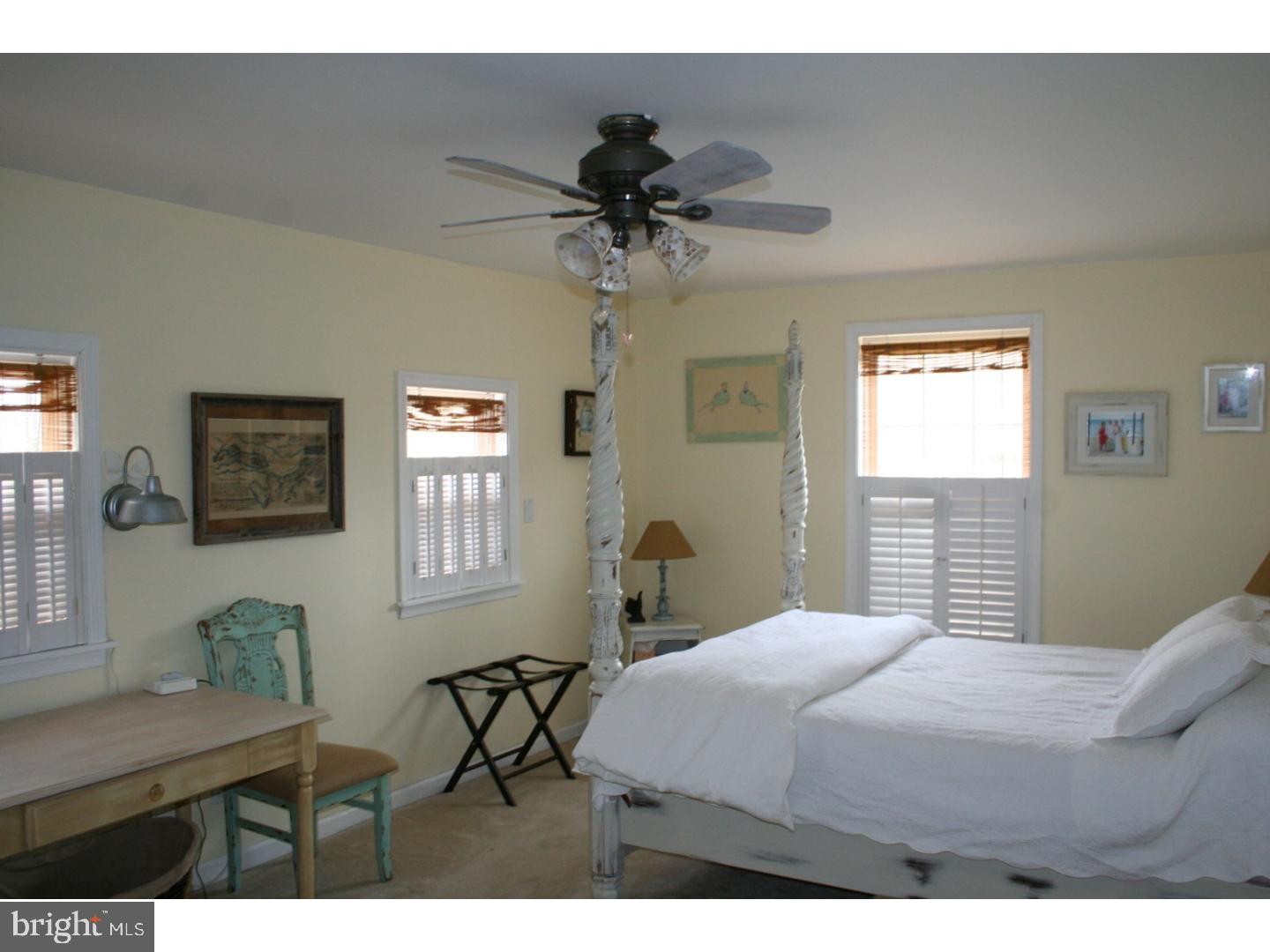 468 Alvine Road Elmer, NJ 08318 - Photo 22 of 25 a bedroom with a bed and a table in it