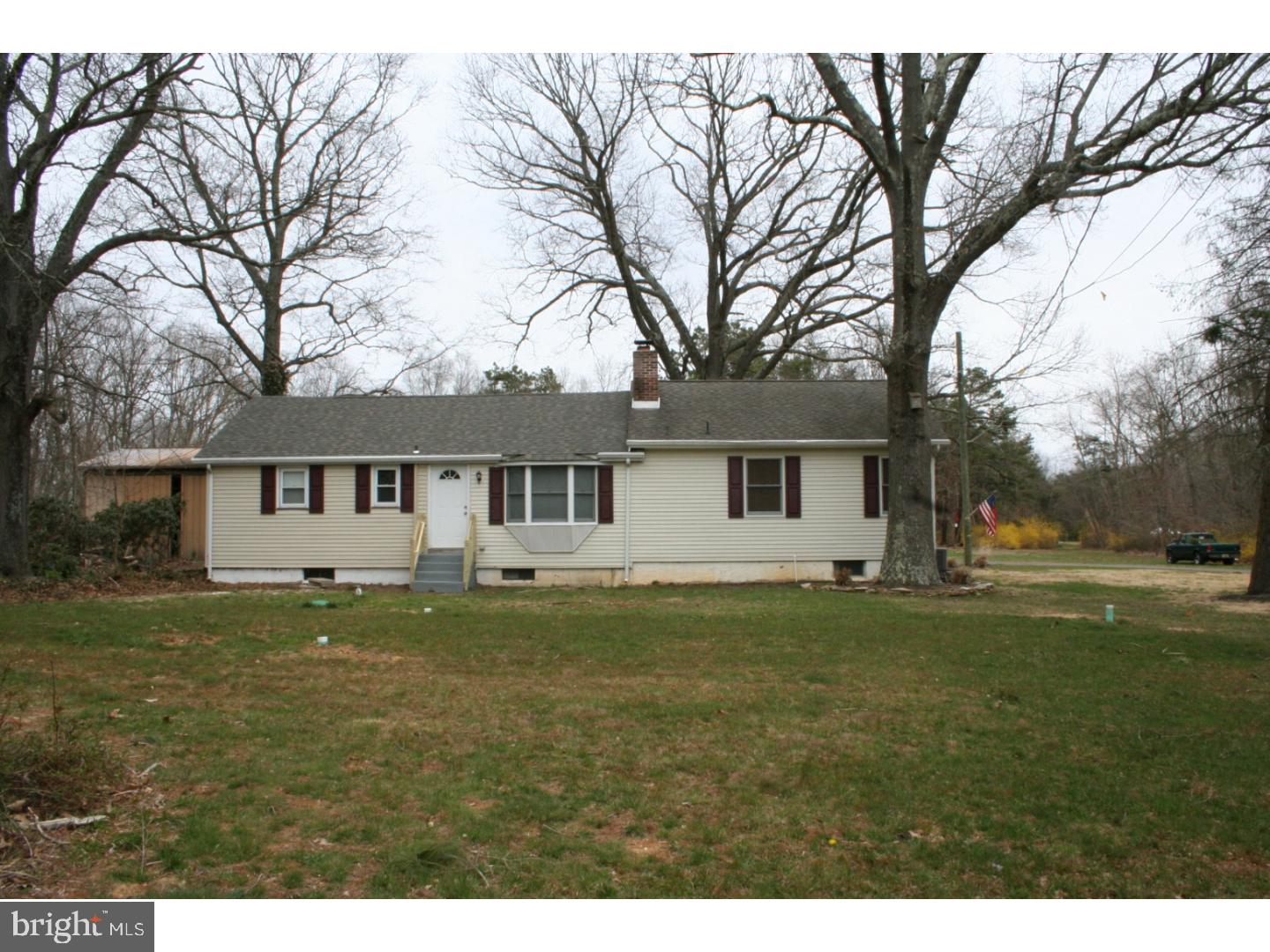 468 Alvine Road Elmer, NJ 08318 - Photo 10 of 25 a house that is sitting in the grass with large trees