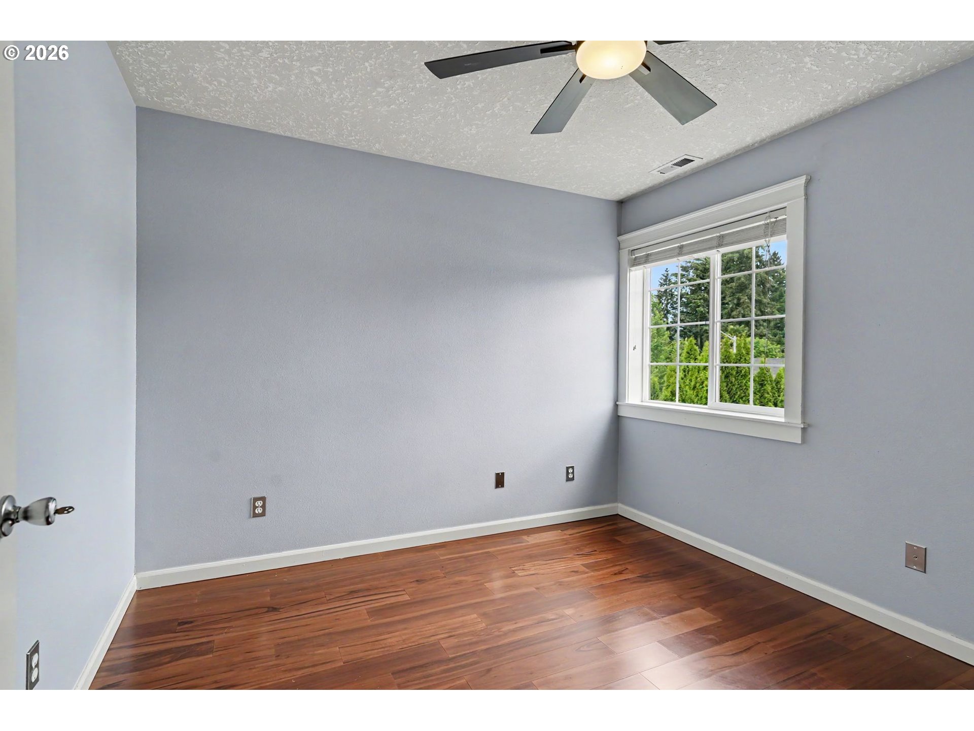 1462 Barnick Road Northeast Keizer, OR 97303 - Photo 36 of 48 a view of an empty room with window and wooden floor