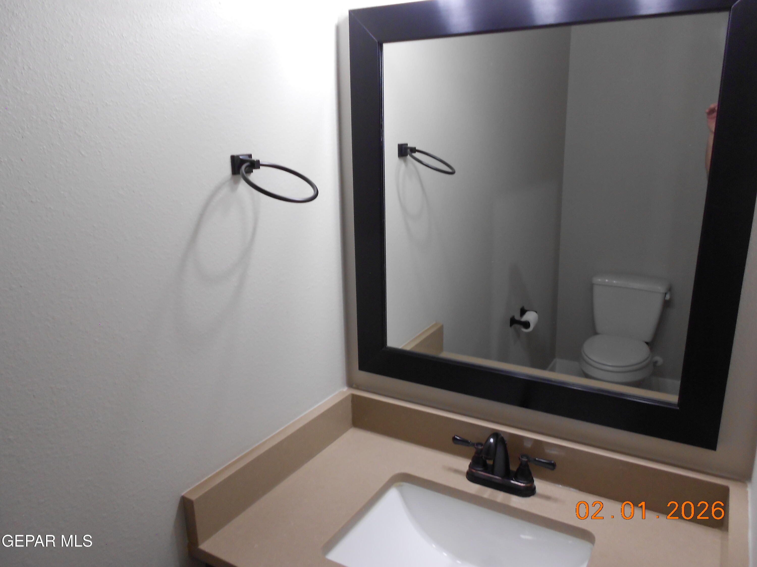 10013 Hueco Jct Road Socorro, TX 79927 - Photo 23 of 27 a bathroom with a sink and a mirror