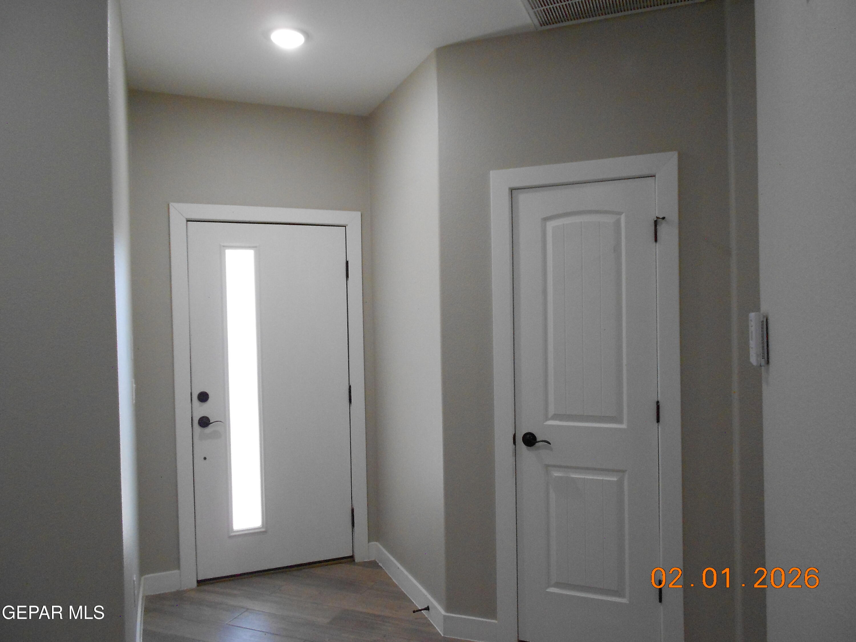 10013 Hueco Jct Road Socorro, TX 79927 - Photo 5 of 27 a view of a hallway with wooden floor