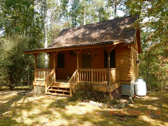 a view of a chair and table in backyard