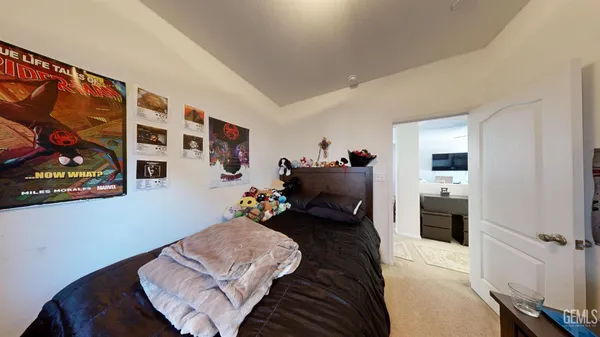 a bed room with a bed and furniture