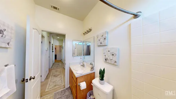 a view of a livingroom with furniture and a flat screen tv