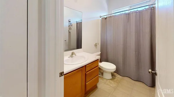 a view of a small space with wooden floor and a window