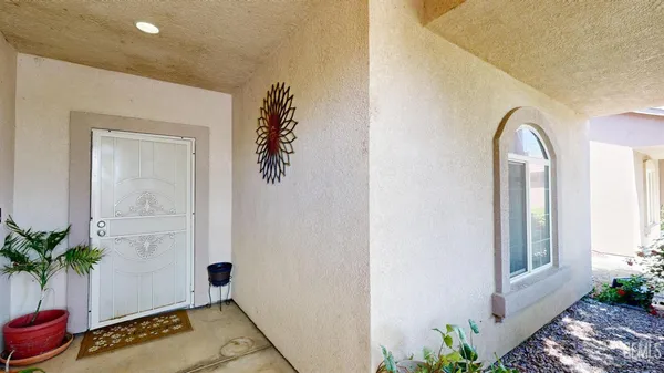 a view of an entryway with wooden floor