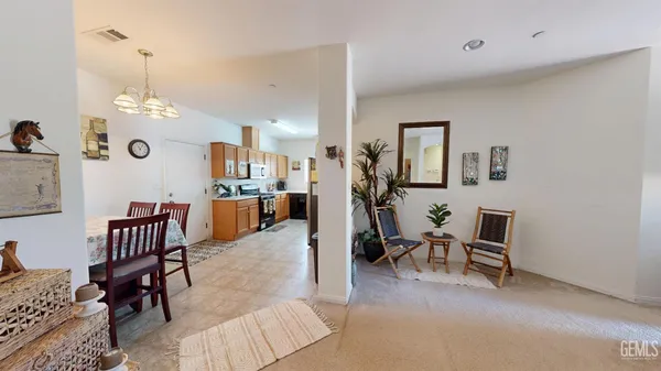 a view of a livingroom with furniture and a table