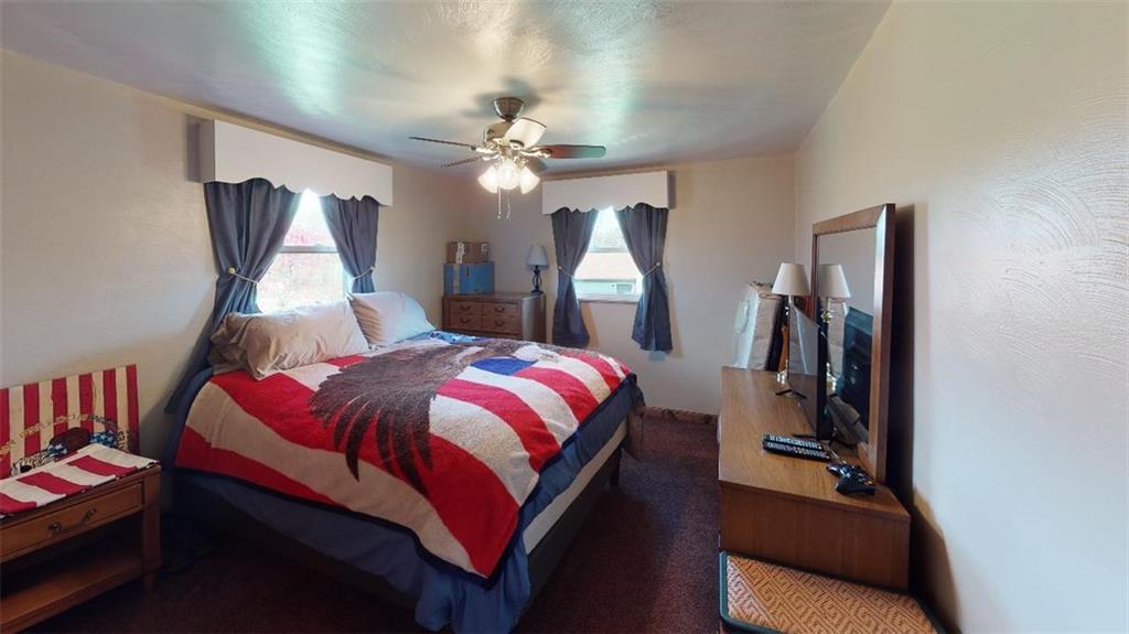 257 Kozy Corner Road Valencia, PA 16059 - Photo 22 of 24 a bed room with a bed and a mirror