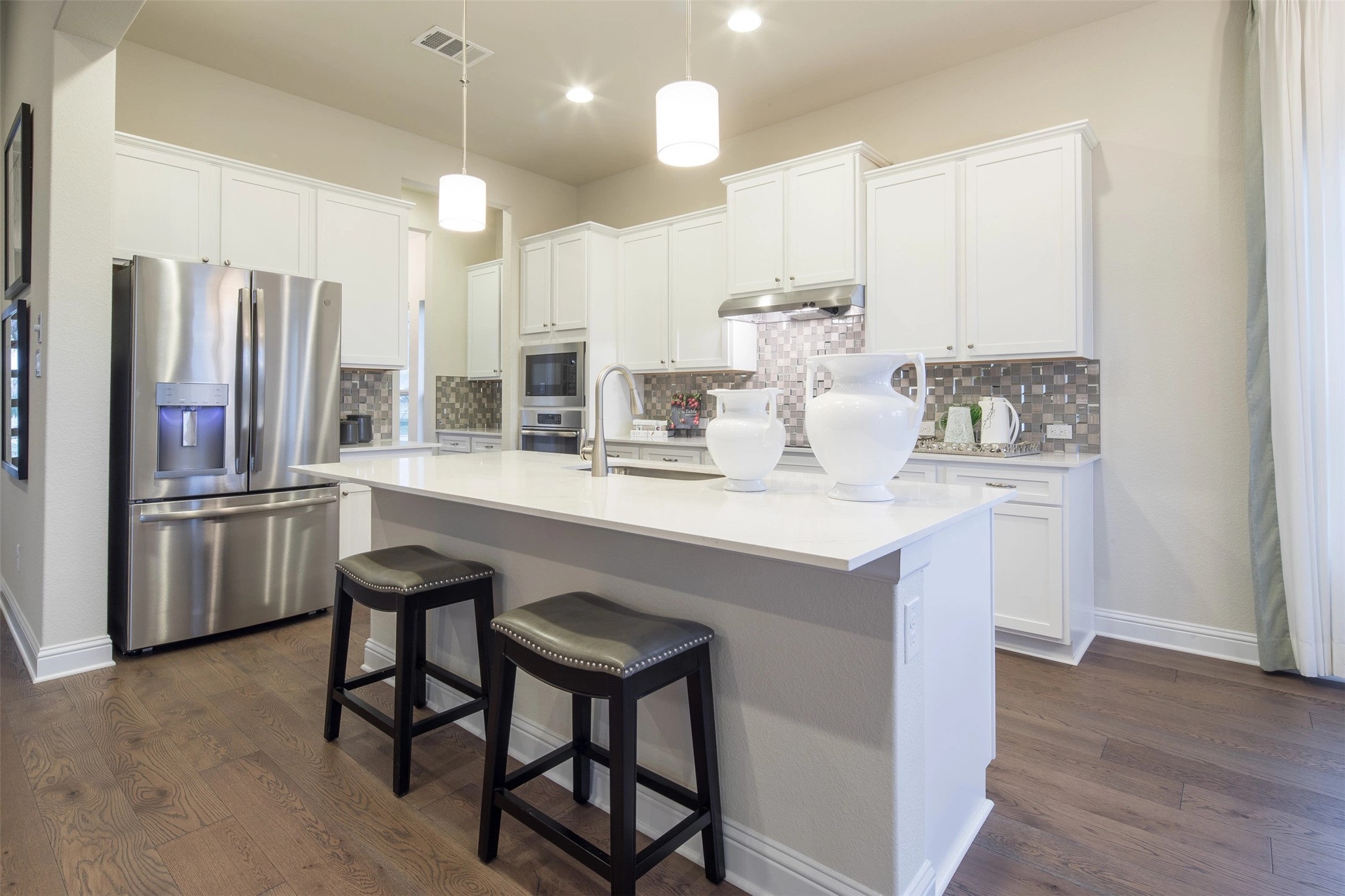 1229 Terrace View Drive Georgetown, TX 78628 - Photo 11 of 17 Culinary delights await in this bright kitchen with a spacious island and gleaming stainless steel appliances.
