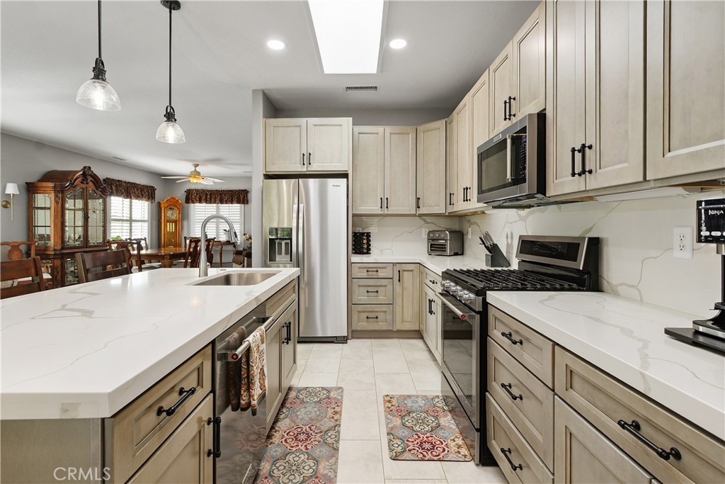 436 Cindy Circle Riverside, CA 92507 - Photo 12 of 37 Everyone can help with preparing meals in this spacious kitchen