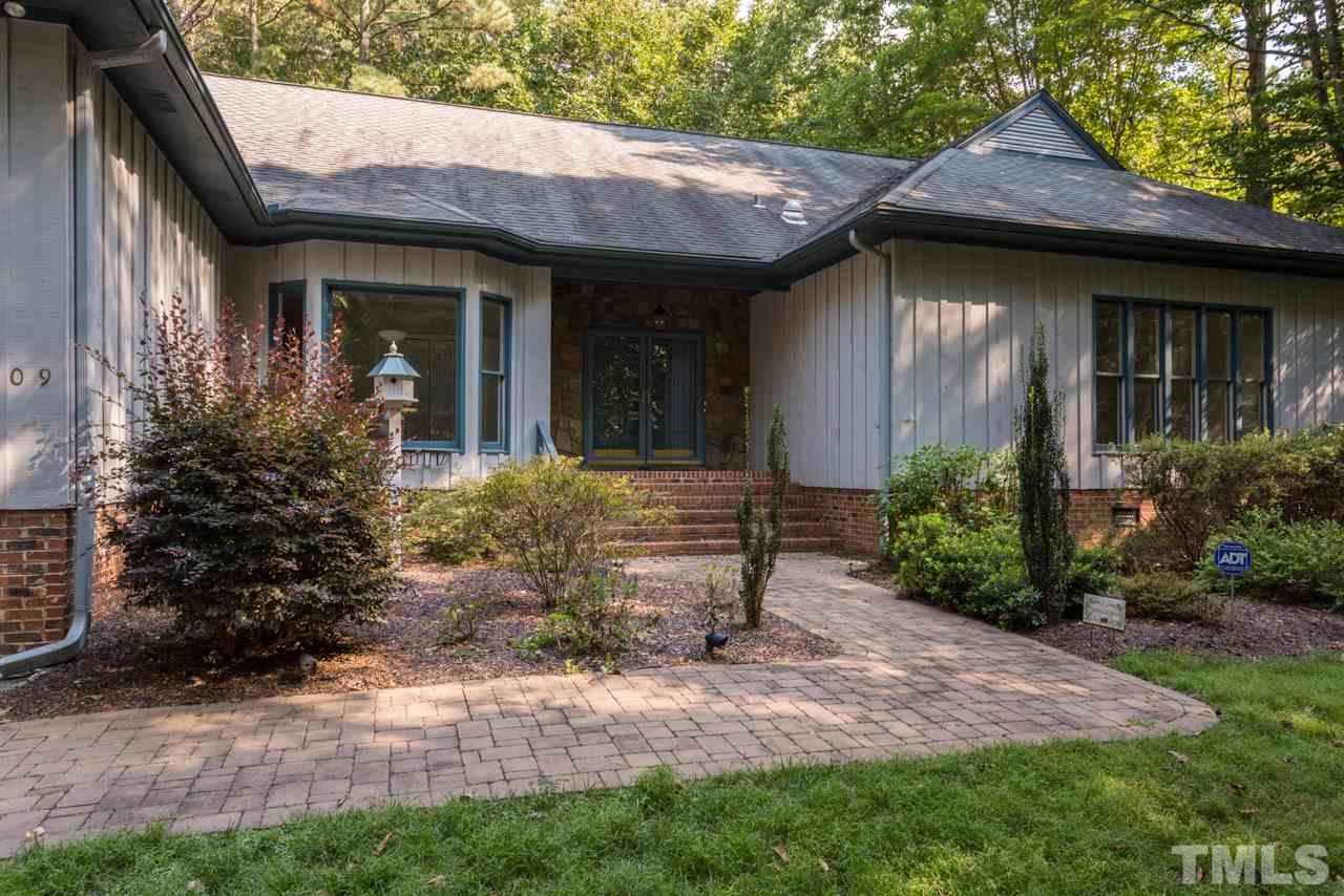 2909 Patrie Place Raleigh, NC 27613 - Photo 2 of 25 a front view of a house with garden