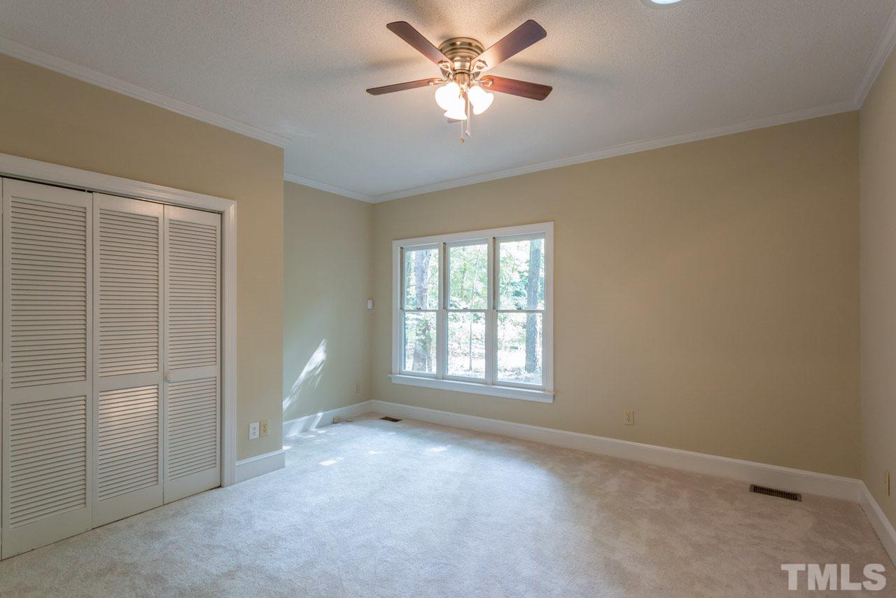 2909 Patrie Place Raleigh, NC 27613 - Photo 16 of 25 an empty room with fan and windows
