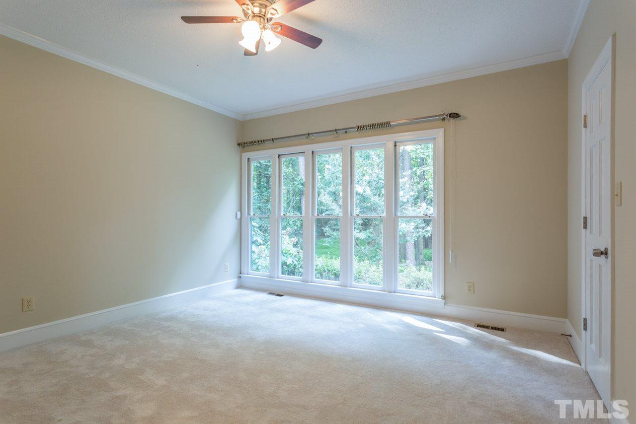 2909 Patrie Place Raleigh, NC 27613 - Photo 17 of 25 a view of an empty room with a window